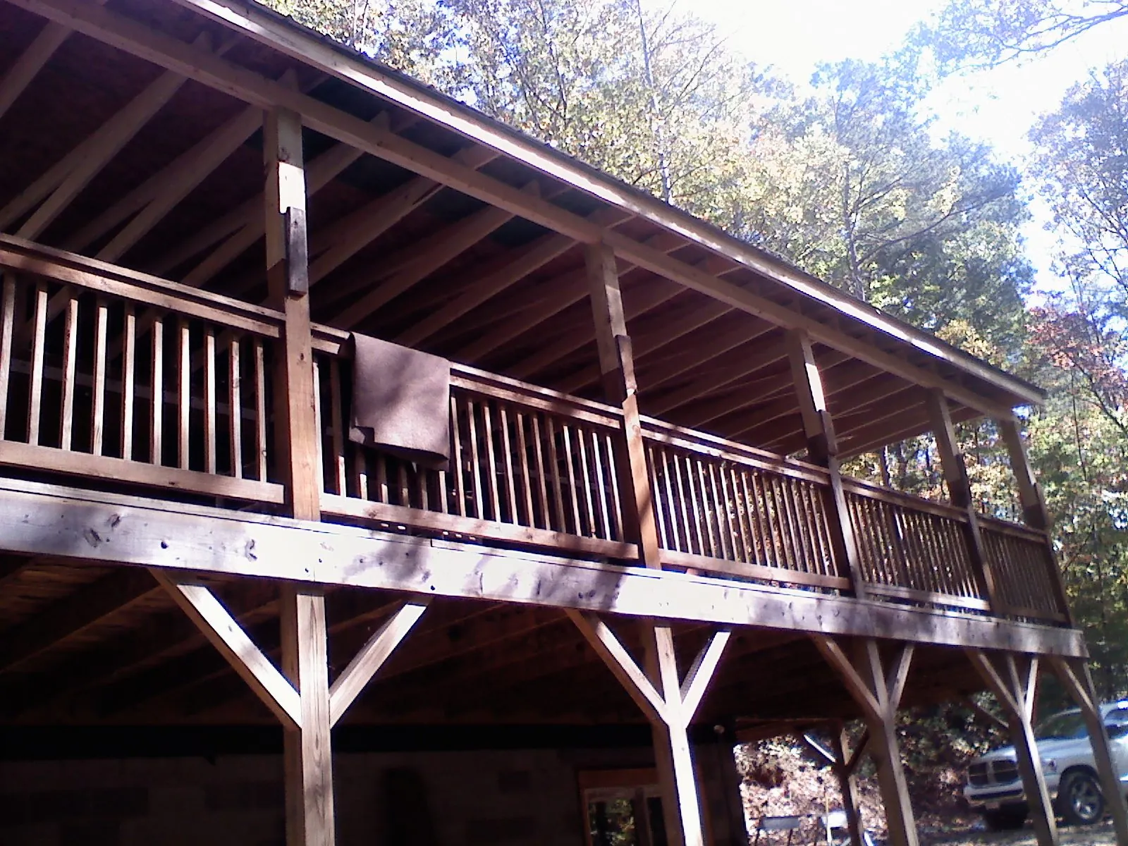 Timber framing under a new elevated porch and deck — Roof Leak Repair in Mill Spring by Roofing Brothers